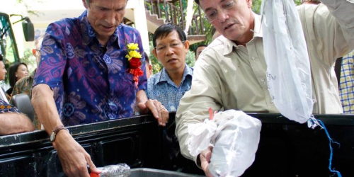 On the right Ambassador Blake and the mayor of Manado looking at the reptiles in the bags and bottles noting the horrible conditions under which these animals are smuggled and how many die in the process.